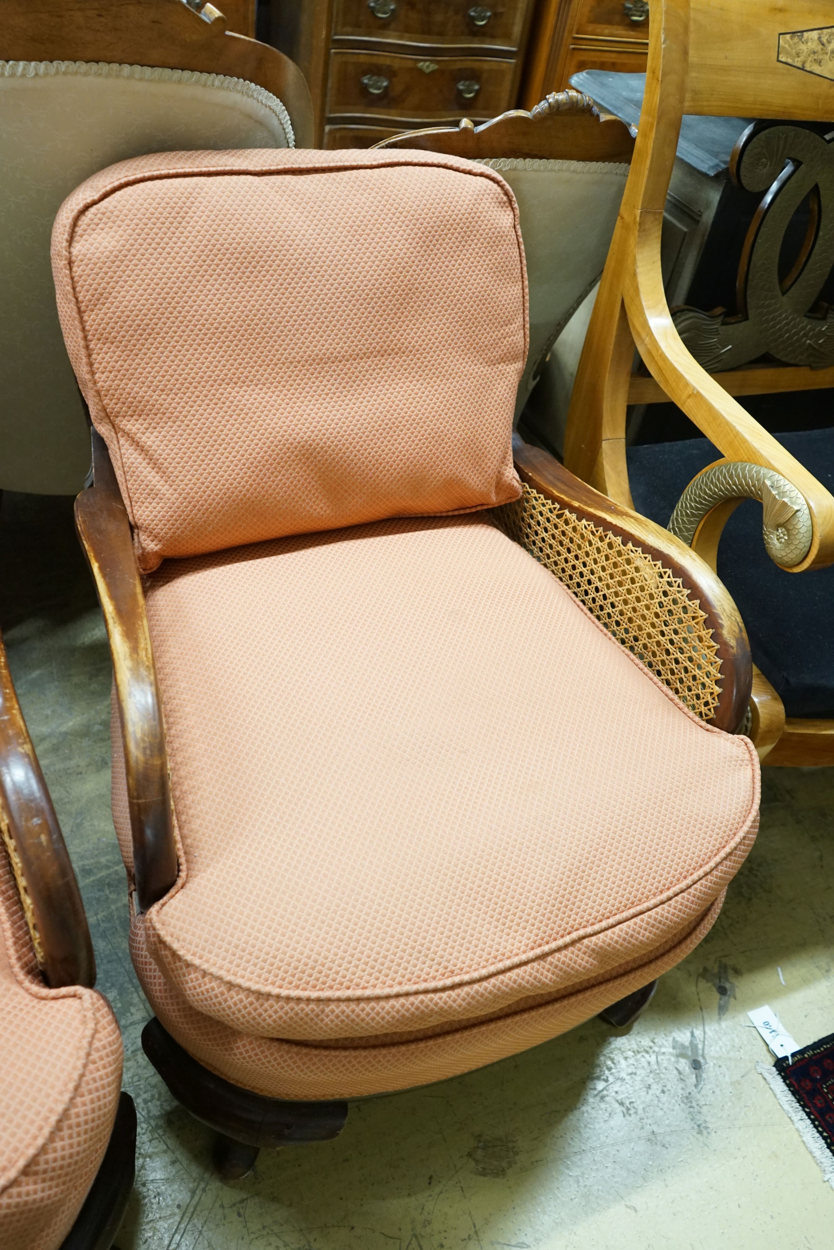 A 1920's caned beech two piece bergere suite, sofa length 167cm, depth 178cm, height 80cm